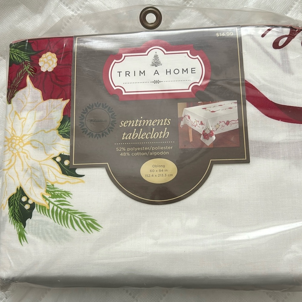 Brand new “trim a home” sentiments fabric tablecloth.